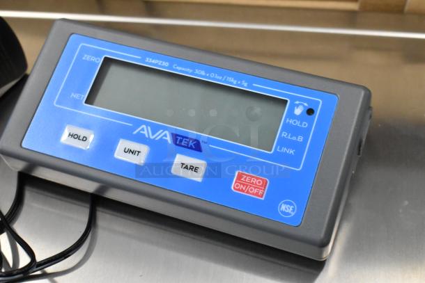 Brand new AvaTek 334PZ30 pizza scale, 30 lb capacity, wireless digital display, buttons for hold, unit, and tare.