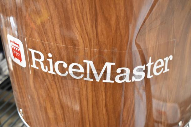 Brand new Town 56918 92 cup commercial rice warmer with woodgrain finish. Visible "RiceMaster" label. 120 volts, 1 phase.