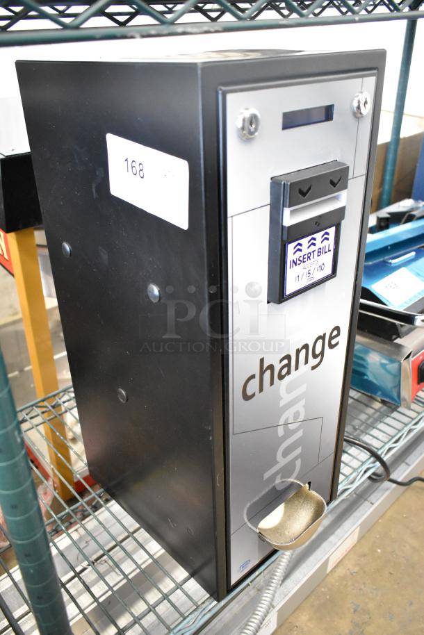 Brand new Seaga CM1250 change machine, model 28ACM1250, with minor scratches. Bill acceptor for $1, $5, $10 bills.