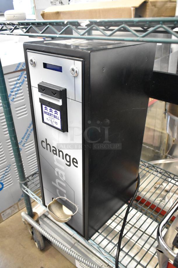 BRAND NEW Seaga CM1250 change machine, model 28ACM1250, with scratch and dent. Bill acceptor for $1, $5, $10 notes.