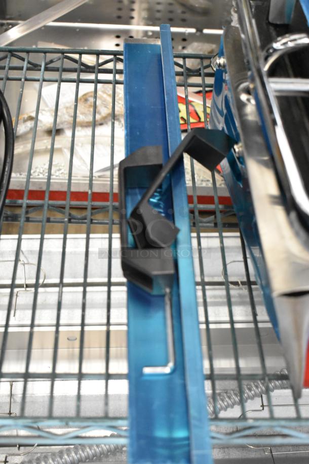 Brand new 2023 Avantco 177PG400GS dual panini grill on shelving, grooved top, smooth bottom, 19 5/8" x 9 1/8", 120V.
