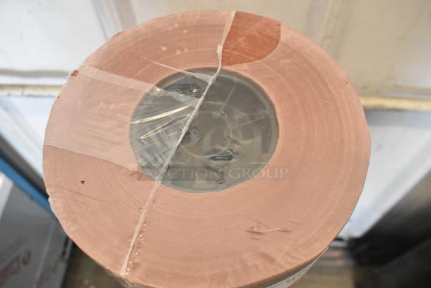 Brand new Choice 43336PEA 36'' x 700' pink/peach butcher paper roll, 40 lb., scratch and dent condition.