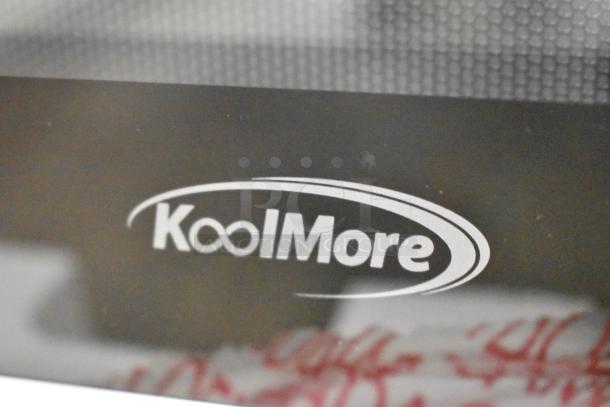 KoolMore KM-CWO24-SS convection oven microwave, 1.5 cu. ft., stainless steel, brand logo visible, minor scratches.