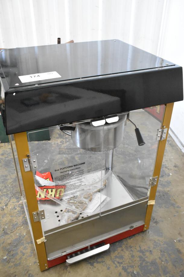 Brand new Benchmark USA 11080 popcorn machine, 8 oz capacity, red, scratch and dent, 120V, 1-phase, visible instructions.