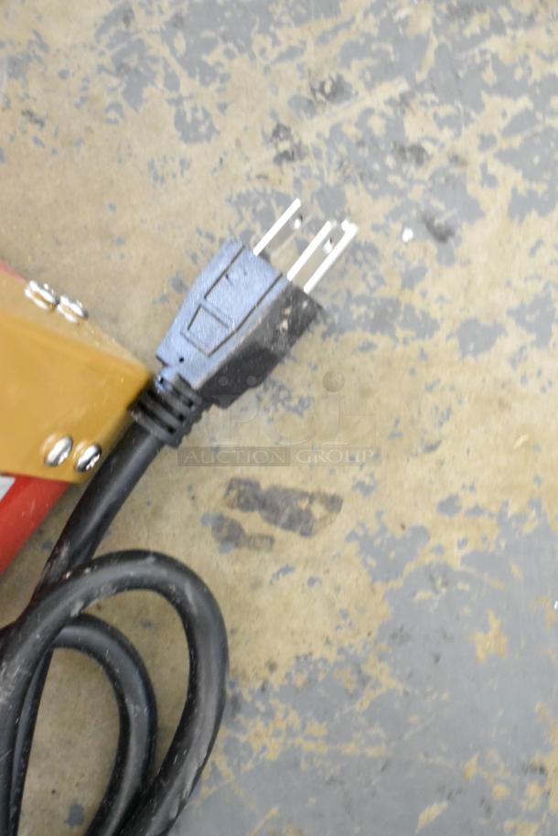 Close-up of the power plug for the 2023 Benchmark USA 11080 Street Vendor 8 oz. Red Popcorn Machine. Brand new condition.