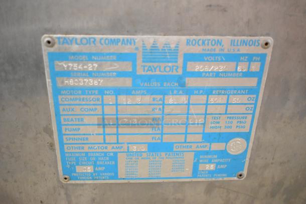 Taylor 754-27 stainless steel 2-flavor twist soft serve machine, commercial casters, 208/230V, 1 phase, serial H8037367.