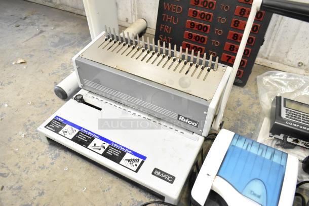 Lot of various items including Ibico binding machine, time cards, and credit card reader. Signs of wear visible.