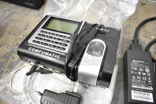 Lot including Compumatic credit card reader and VeriFone adapter, both with visible cables. Items appear used.