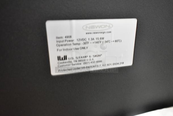 Label on Open Sign, model 4966, from NEWON. Specs: 12VDC, 1.3A, 15.6W, indoor use only. U.S. Stamp & Sign branding.