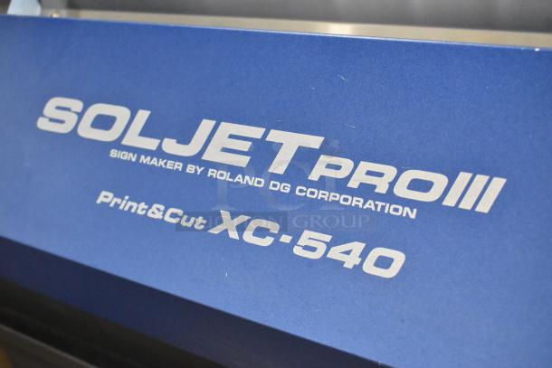 Soljet Pro III XC-540 large format printer, 100-120V, 1 phase, on casters. Visible branding and model details on blue panel.