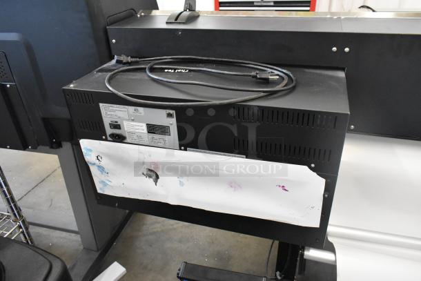 Soljet Pro III XC-540 large format printer on casters. Features 100-120 volts, 1 phase. Black casing, power cord visible.