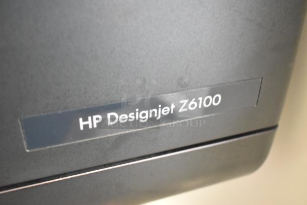 HP DesignJet Z6100 large format printer label, indicating model and floor style. 115 volts, 1 phase operation.