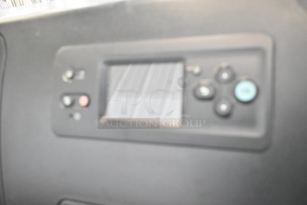 HP DesignJet Z6100 large format printer control panel, showing buttons and blurred display. Powered at 115 volts, 1 phase.