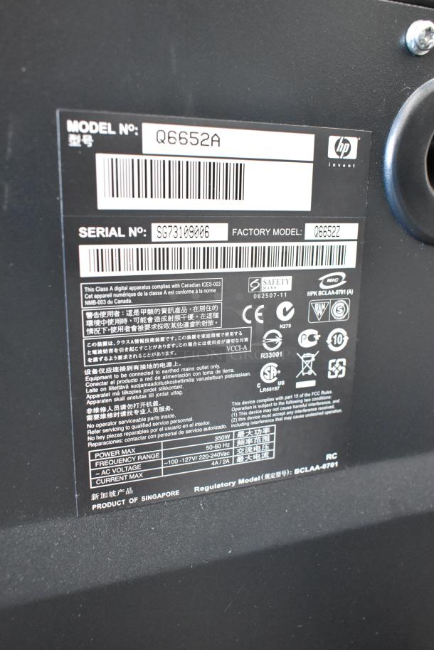 HP DesignJet Z6100 large format printer, Model Q6652A, Serial SG73109006, 115V, 1 Phase, regulatory details visible.