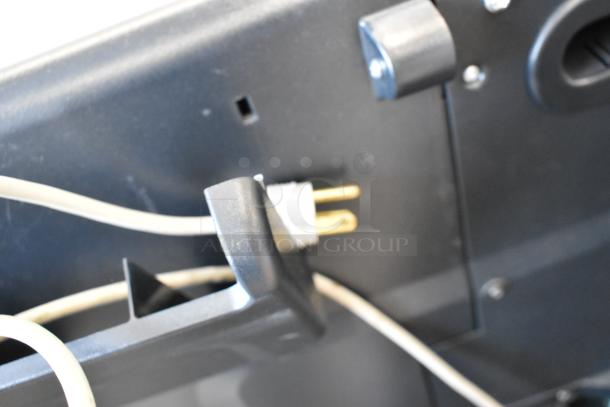 HP DesignJet Z6100 printer plug view, showing 115 volts, 1 phase power requirements; close-up of cables and plug.