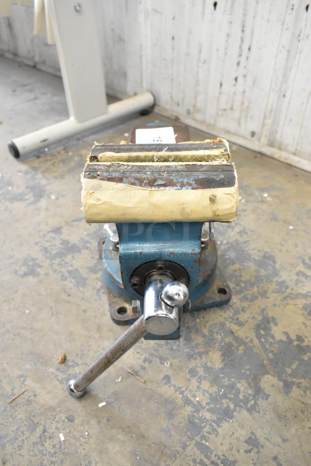 Larin APV-5S Bench Vise, blue with visible wear. Tightens well but will not loosen. Baseplate is attached, handle intact.