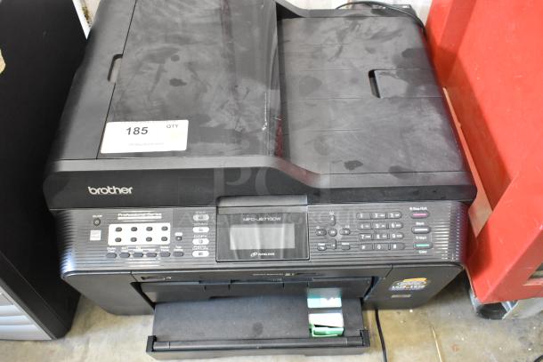 Brother MFC-JB710DW printer and Compaq computer tower. Printer with visible controls and logo. Auction label #185.
