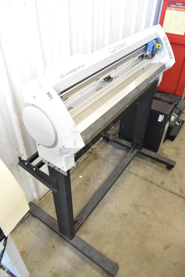 Roland Camm-1 Pro GX-300 Sign Maker on stand, 100-240V, 1 Phase. Visible control panel, good condition.
