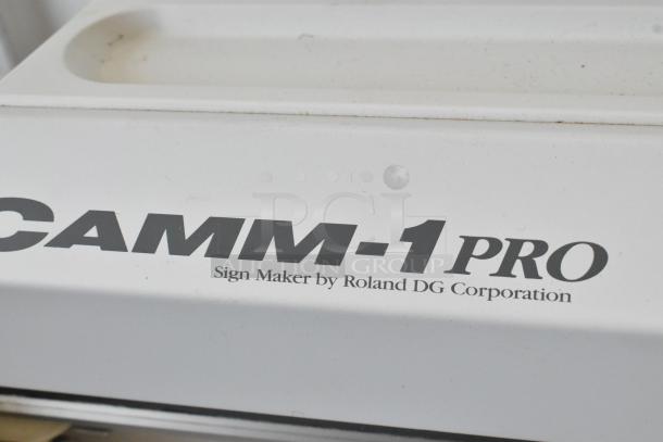 Roland Camm-1 Pro GX-300 Sign Maker, 100-240V, 1 Phase, white casing, branding visible, in used condition.
