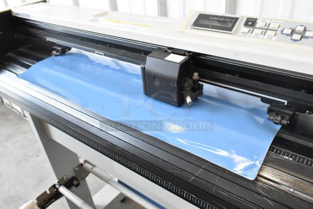 Mimaki CG-60EX Cutting Plotter, 120V, 1 Phase, features a control panel, good condition, visible cutting setup.