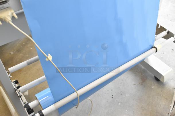 Mimaki CG-60EX Cutting Plotter in used condition, 120V, 1 Phase, featuring blue material roll setup, essential for precision cutting tasks.