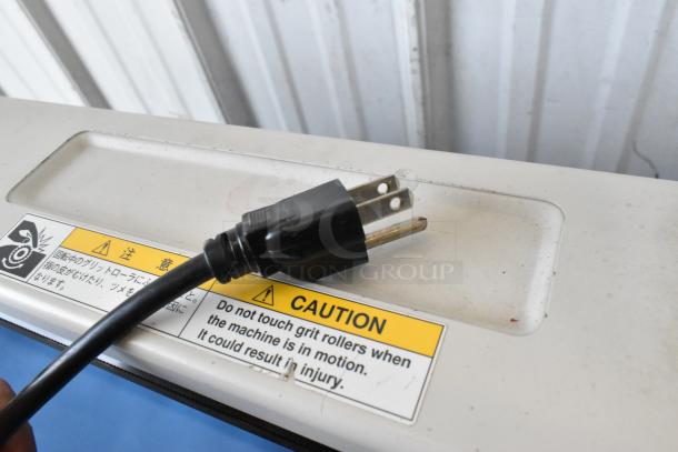 Mimaki CG-60EX Cutting Plotter with a power plug and caution label. 120 Volts, 1 Phase. Clean condition.
