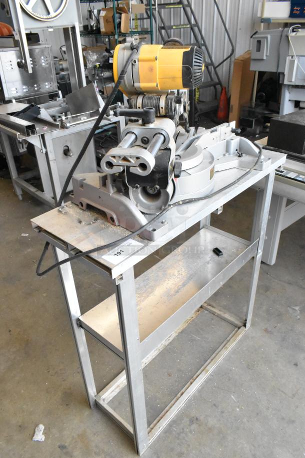 DeWalt DW718 15 Amp Corded Miter Saw on metal stand. Features single bevel, 120V, 1 phase. Moderate wear visible.
