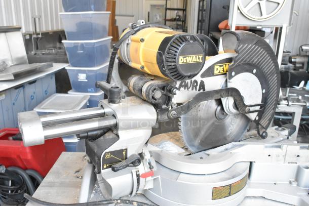 DeWalt DW718 15 Amp corded compound miter saw, single bevel, visible markings, 120V, used condition.