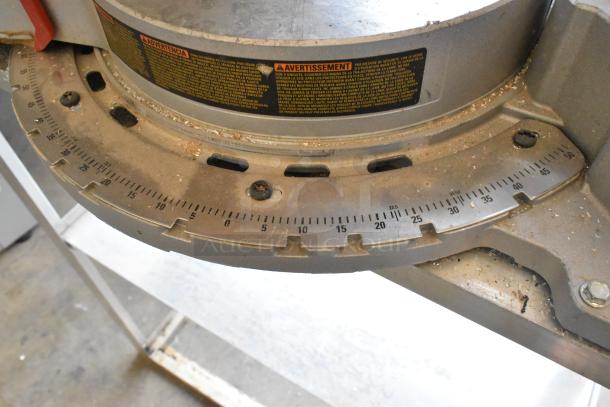 DeWalt DW718 Miter Saw showing angle scale. Used condition, clear markings, safety warnings visible.