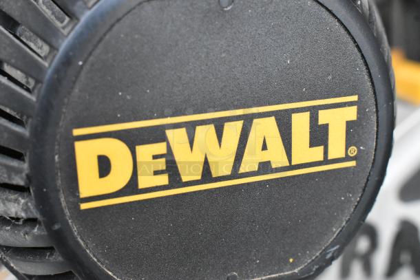 DeWalt DW718 miter saw, 15 Amp, corded, single bevel, 120V, 1 phase. Close-up of DeWalt logo, showing tool's authenticity.