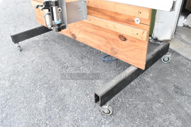 Fletcher 3100 63" multi-material cutter on commercial casters, featuring sturdy wooden and metal construction.