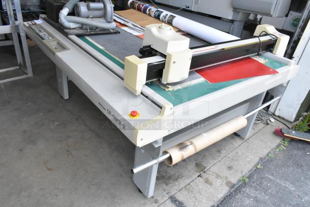 Mimaki CF-0912-2 Flatbed Cutter, in used condition. Features visible control panel, cutting arm, and spool holder.