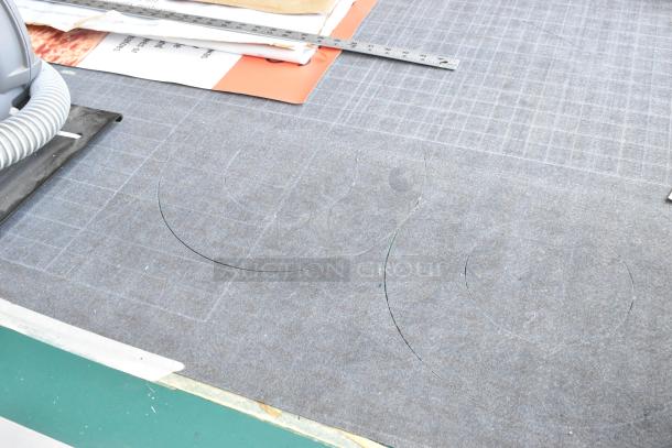 Mimaki CF-0912-2 Flatbed Cutter showing cutting mat and grid lines, in good working condition.