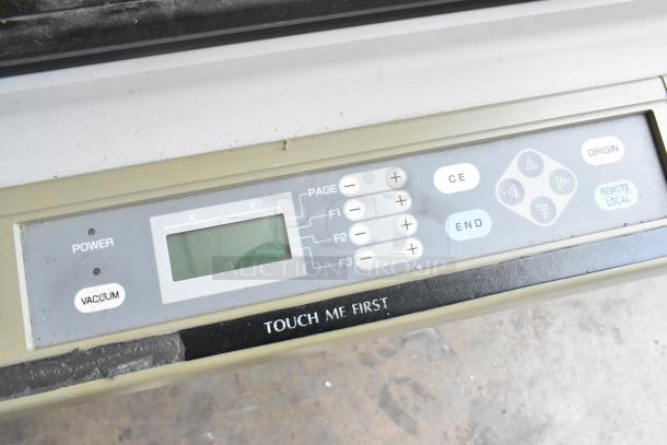 Control panel of Mimaki CF-0912-2 Flatbed Cutter showing digital display and function buttons. Good condition.