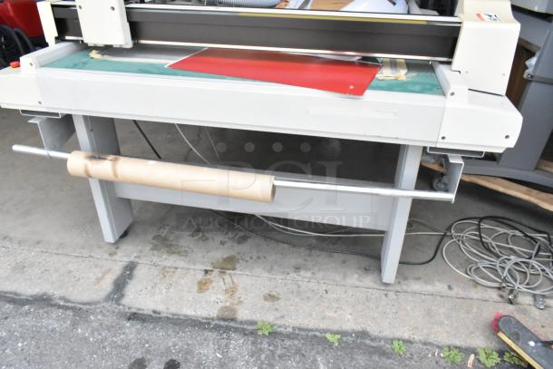 Mimaki CF-0912-2 Flatbed Cutter in working condition with visible power cables and peripheral attachments.