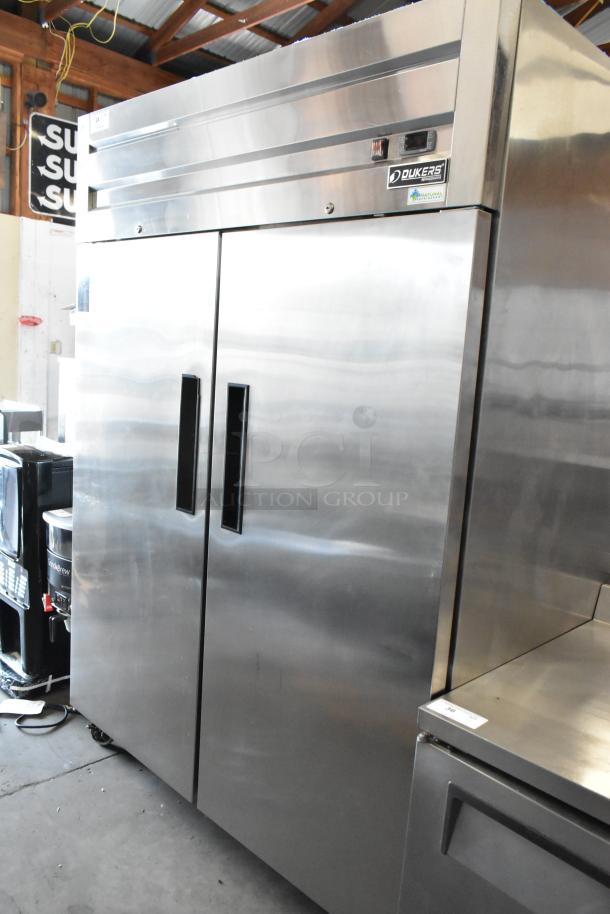 Dukers D55AR stainless steel 2-door reach-in cooler with poly-coated racks, commercial casters, and 115V, 1 phase power.