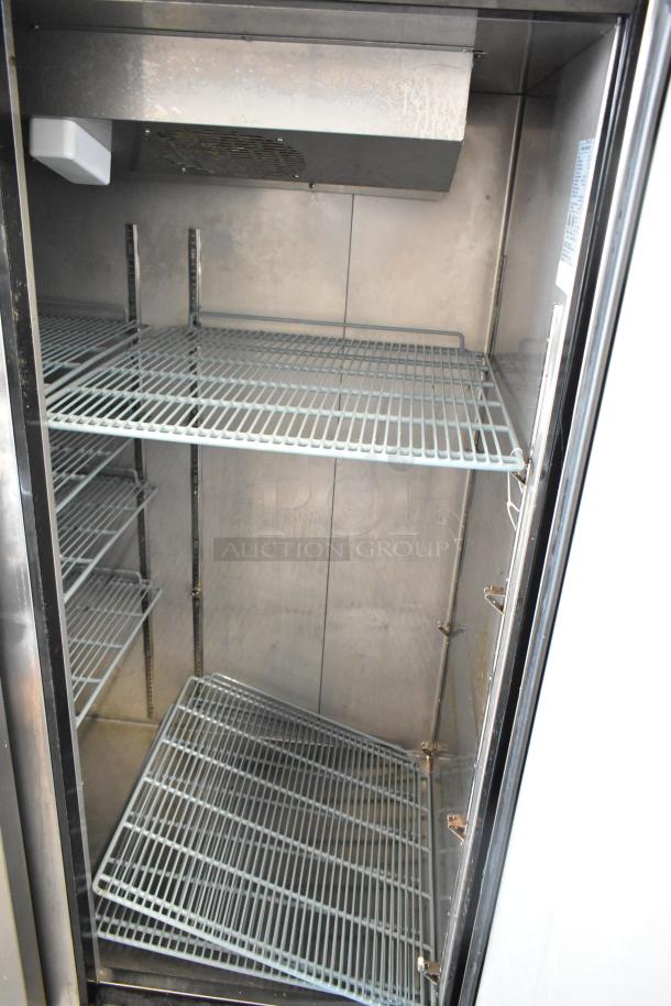 Dukers D55AR stainless steel 2-door cooler with poly-coated racks, on commercial casters. Interior view, 115V, 1 phase.
