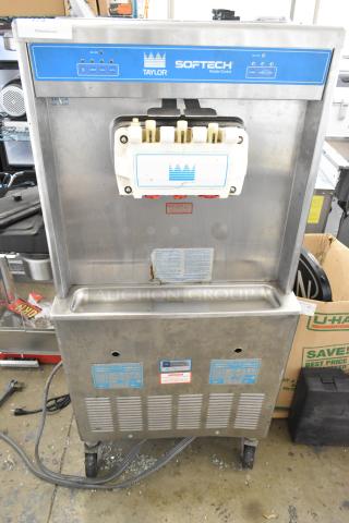 Taylor 754-27 Stainless Steel Commercial Floor Style 2 Flavor w/ Twist Soft Serve Ice Cream Machine on Commercial Casters. 208/230 Volts, 1 Phase. - Item #1199501