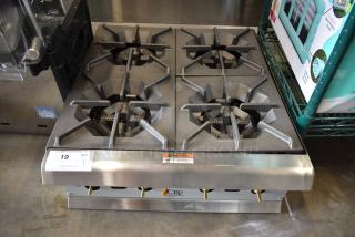 BRAND NEW SCRATCH AND DENT! Cooking Performance Group 351RCPG24NL R-CPG-24-NL Stainless Steel Commercial 4 Burner Natural Gas Powered Countertop Range / Hot Plate - 88,000 BTU