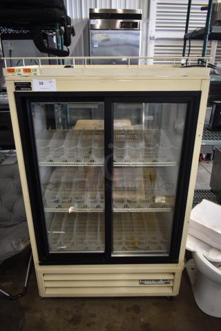 Beverage Air MT15-54 Metal Commercial 2 Door Reach In Cooler Merchandiser w/ Poly Coated Racks on Commercial Casters. 115 Volts, 1 Phase.