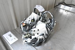 Pair of Crocs 9-11 Black and White Shoe