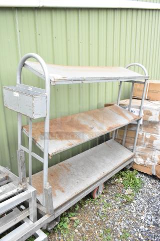 Gray Metal 3 Tier Cart on Commercial Casters.