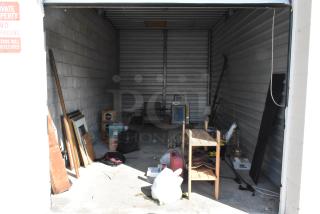 ALL ONE MONEY! Lot of Entire Contents of Storage Unit #35. Unit Appears to Contain: Lamp, Wooden Shelving Unit, Framed Pictures, Chair, Toolbox. Cleaning Deposit of $100 per Unit Paid on Pickup Day. Winner Has 7 Days From Close of Auction to Remove Items. All Items Must Be Removed and Unit Must Be Broom Swept to Get Cleaning Deposit Returned.