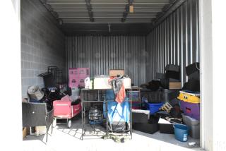 ALL ONE MONEY! Lot of Entire Contents of Storage Unit #58. Unit Appears to Contain: Poly Bins, Chair, Wagon, Lamp, End Tables. Cleaning Deposit of $100 per Unit Paid on Pickup Day. Winner Has 7 Days From Close of Auction to Remove Items. All Items Must Be Removed and Unit Must Be Broom Swept to Get Cleaning Deposit Returned.