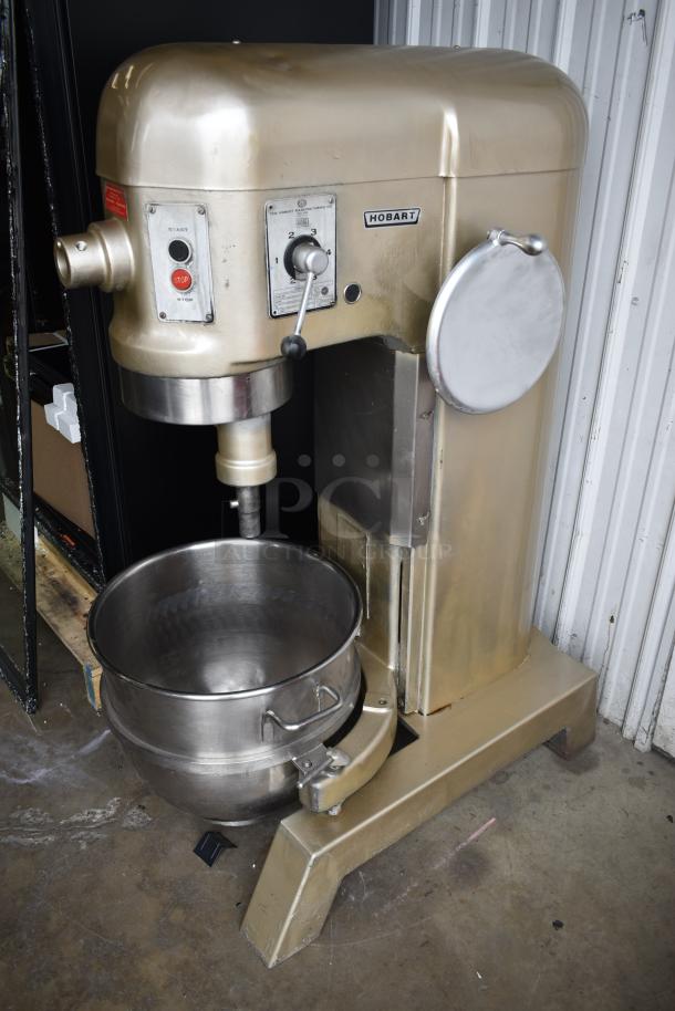Hobart industrial mixer, model tags visible, with stainless steel bowl, lever controls. Signs of light use, well-maintained.