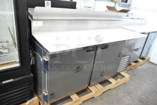 BRAND NEW SCRATCH AND DENT! Beverage Air DP67 Stainless Steel Commercial Pizza Prep Table w/ Commercial Casters. 115 Volts, 1 Phase. - Item #1190375