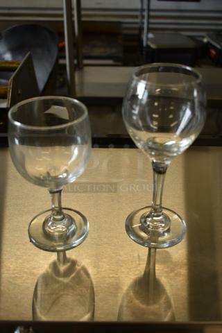 2 BRAND NEW SCRATCH AND DENT! Items Including Libbey 3764 8.5 oz Wine Glasses and Libbey 3064 Perception 8 oz Wine Glasses. 2 Times Your Bid!