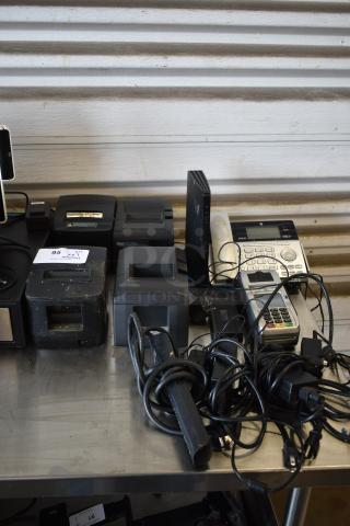 7 Various Items Including 2 V320L Thermal Receipt Printer, Star Micronics TSP650 Receipt Printer, Star Micronics TSP100, Corded Telephone, First Data FD130 Credit Card Reader. 7 Times Your Bid!