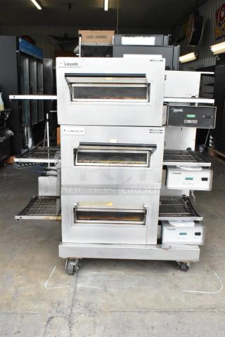 3 Lincoln Impinger 1137002-UK184 Stainless Steel Commercial Electric Powered Conveyor Pizza Oven on Commercial Casters. 208/240 Volts, 1 Phase. 3 Times Your Bid! - Item #1190929