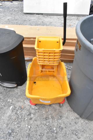 Winco Yellow Poly Mop Bucket w/ Wringing Attachment on Commercial Casters.